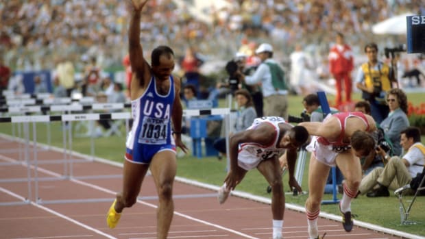 Greg Foster celebrates after a hurdles race in Stuttgart in 1993.